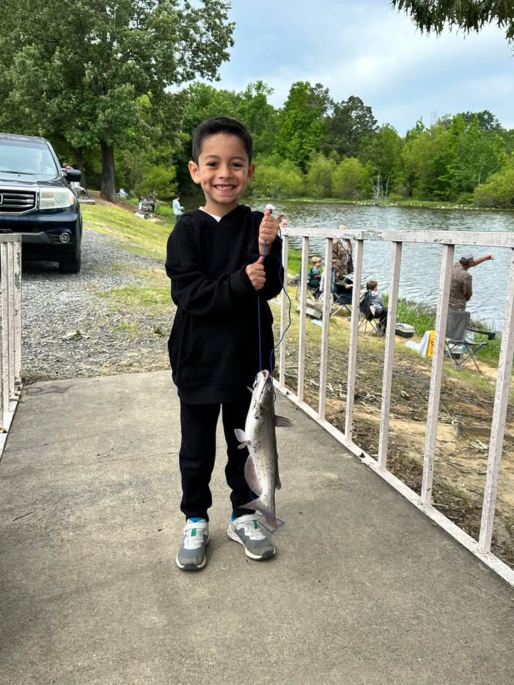 Happy kid with his fish