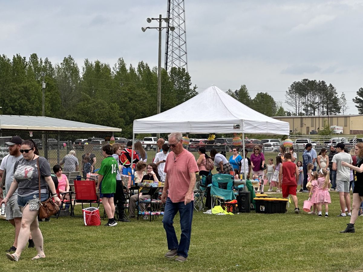 Crowd of people registering for the egg hunt