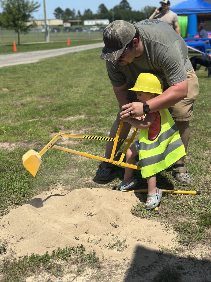 Dad helping with digging toy