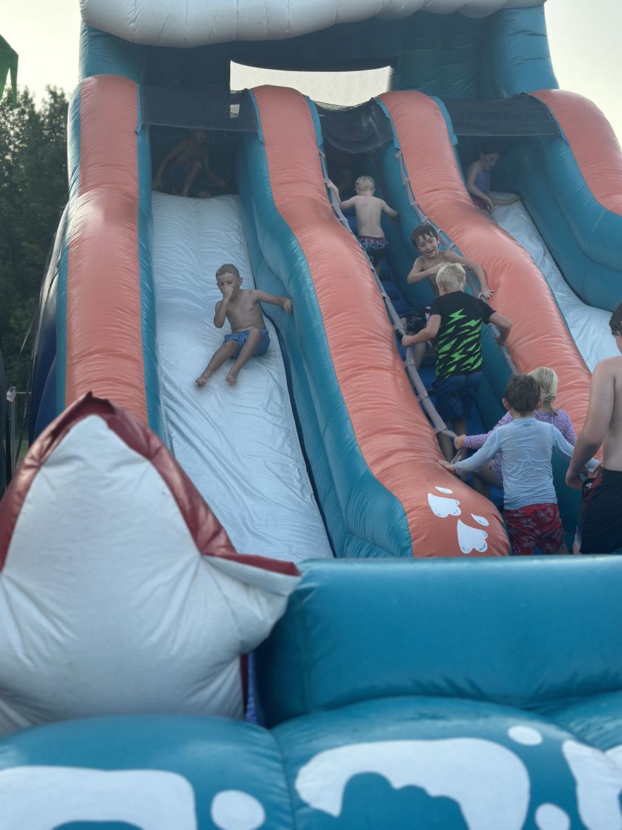 Kids beating the heat with the waterslides