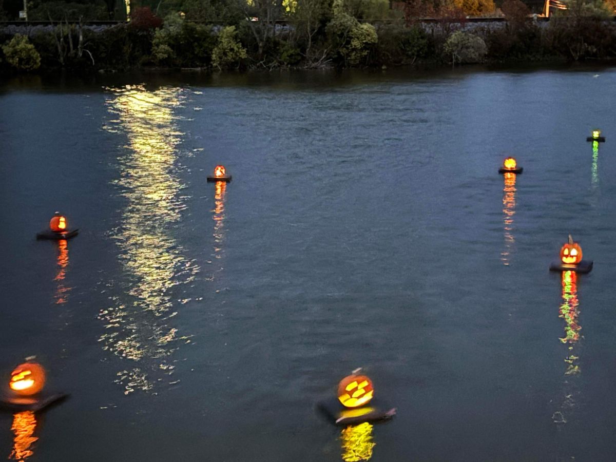 Glowing pumpkins floating on the water